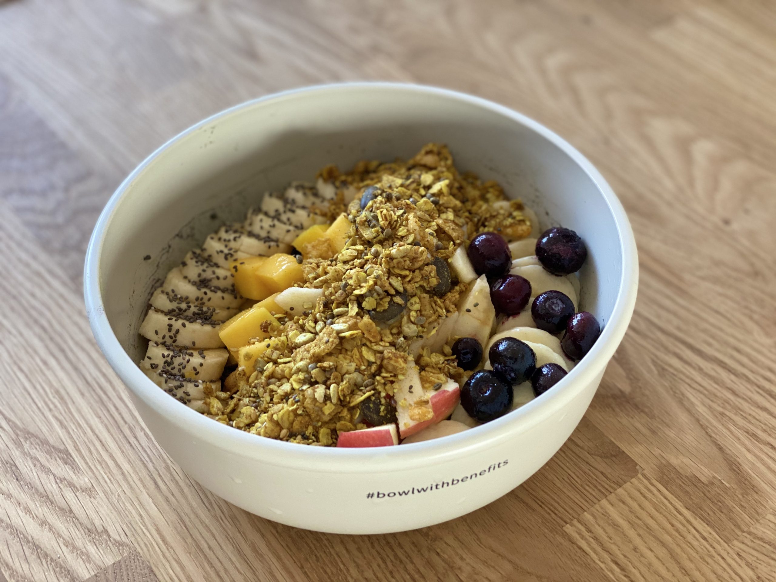 Close-up of a VYTAL bowl with cereal and fruit in it.